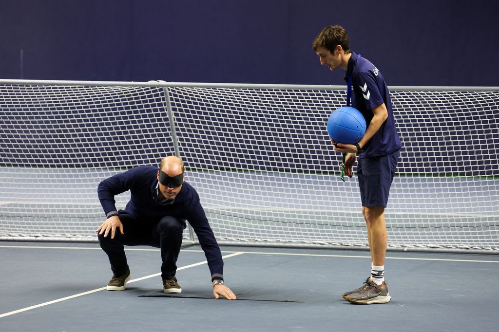 Prince William wearing blindfold on indoor court 