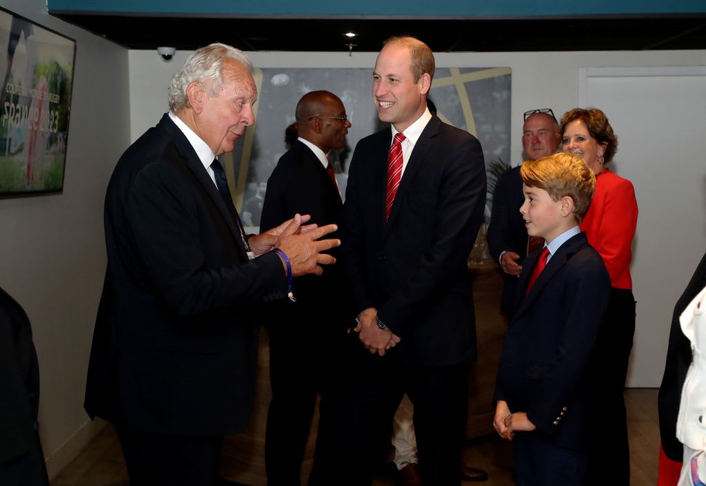 Sir Bill Beaumont, chairperson of World Rugby, meets Prince William and Prince George during the Rugby World Cup in France