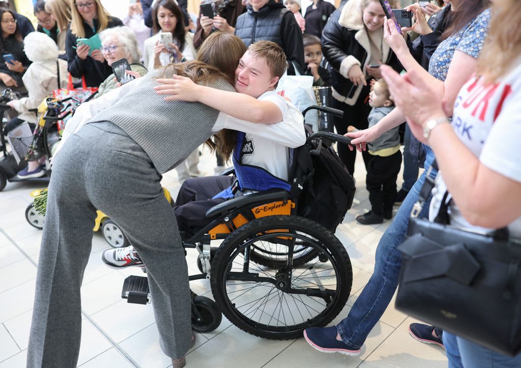 Kate Middleton hugs a well-wisher in Bracknell