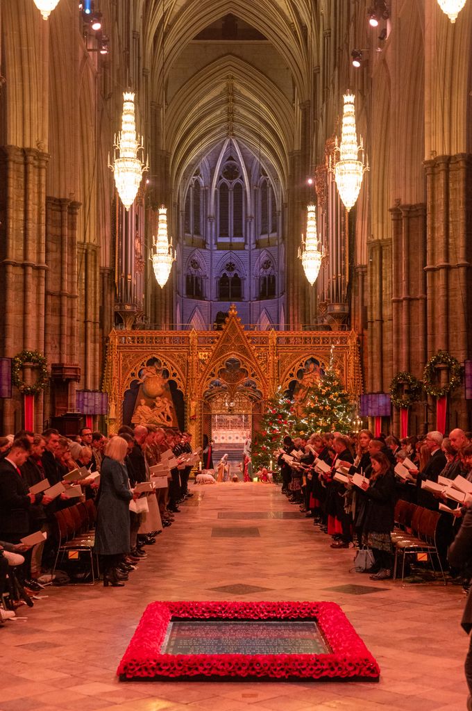 The interior of Westminster Abbey decorated with Christmas trees and wreaths