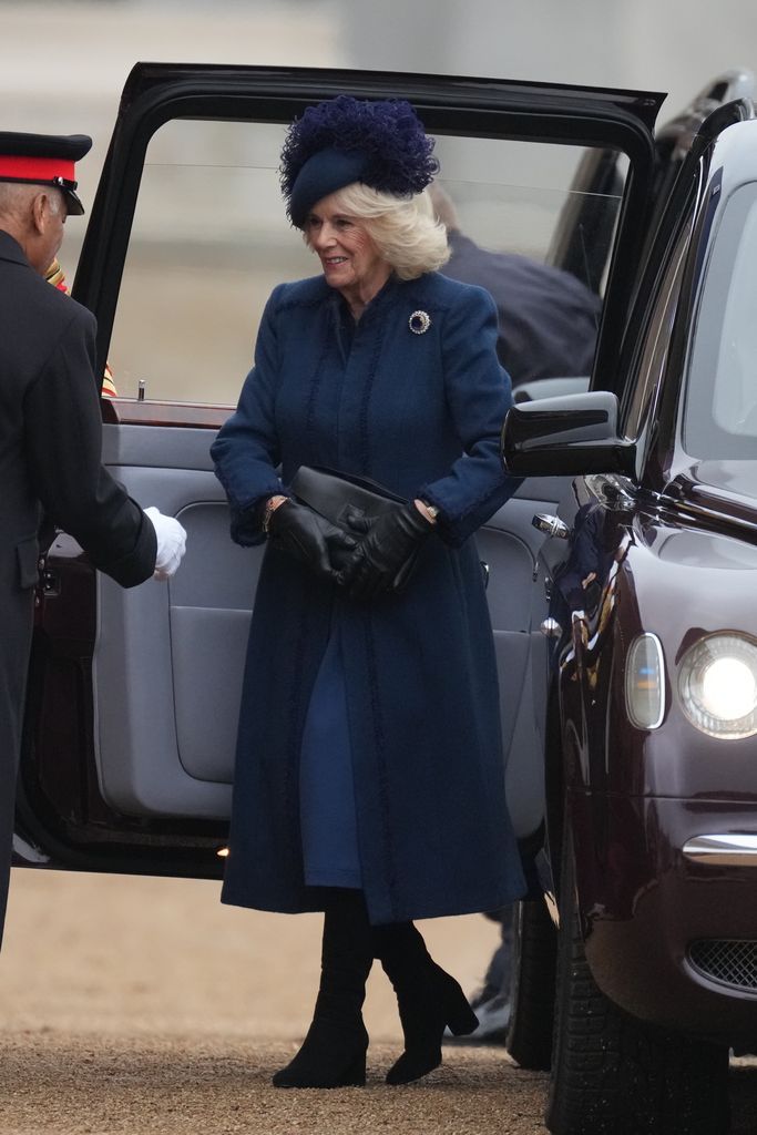 queen wearing blue coat and dress 