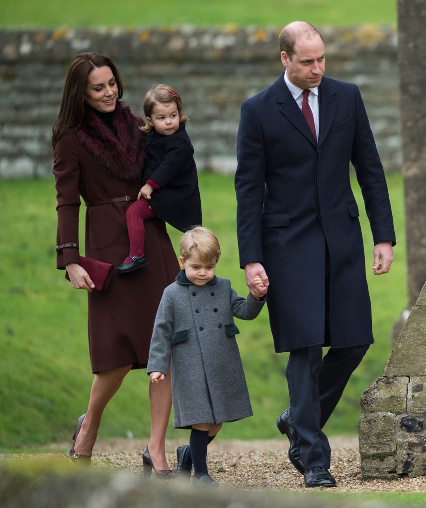 Kate Middleton holds toddler-aged Princess Charlotte while Prince William holds hands with young Prince George as they attend Christmas Day services in Bucklebury, Berkshire in 2016.