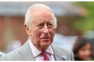 King Charles smiling as he makes a dark-humored joke about his health during a royal event